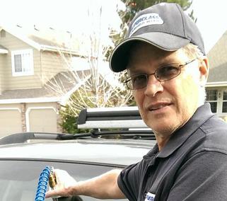 One of our employees doing chip repair services in Denver, CO